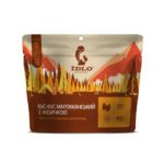 Кус-кус марокканский с индейкой на фоне одежды и обуви для активного отдыха, туристическая экипировка, обувь для походов и путешествий для любителей активного образа жизни